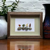 Four Sea Glass Birds on Rocks Picture